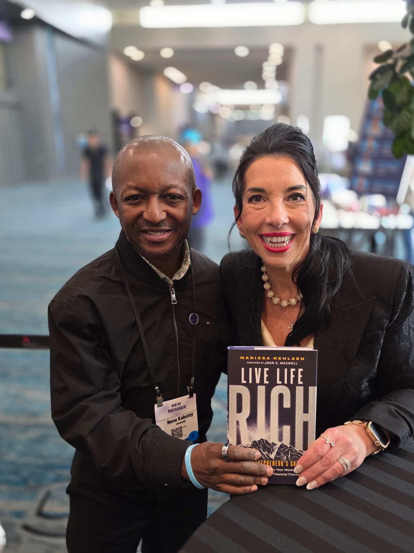 Nene with author Marissa Nehlsen holding her book Live Life Rich